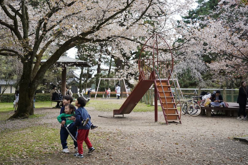 Children play in the playground area of Kyoto Imperial Palace