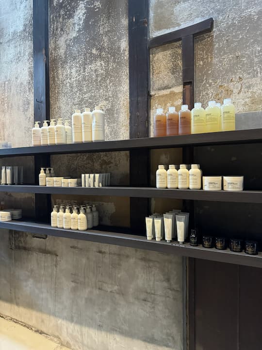 Fragrance area displaying essential oils and perfumer notes at LE LABO Kyoto Machiya Café