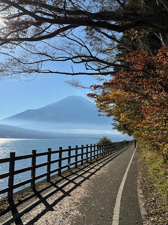 Cycling around Lake Yamanaka near Fuji Matsuzono Hotel with a distant view of Mount Fuji