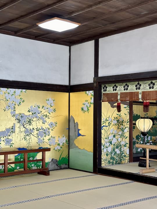 Intricate and colorful wall paintings inside Chishakuin Temple in Kyoto, reflecting traditional Japanese artistry