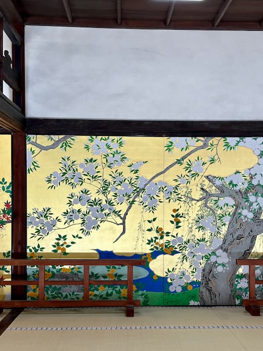 Intricate and colorful wall paintings inside Chishakuin Temple in Kyoto, reflecting traditional Japanese artistry