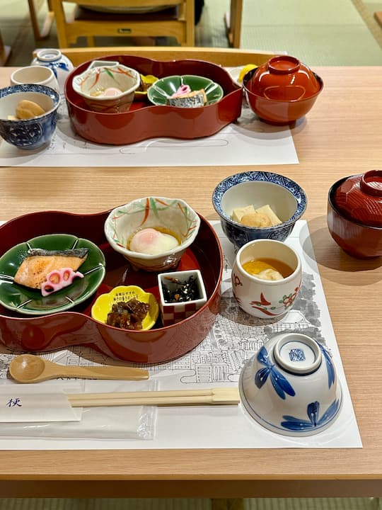 A traditional Japanese breakfast served at Chishakuin Temple in Kyoto, featuring a variety of simple dishes