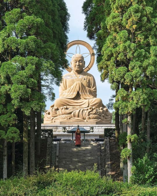 Majestic grand Buddha statue at Okunoin Temple in Kumamoto, Japan