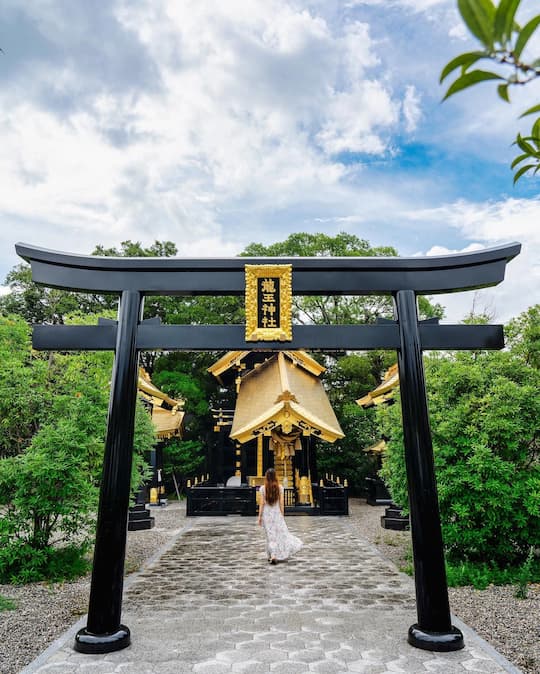 Ryuo Shrine with its distinctive black and gold exterior in Kumamoto, Japan