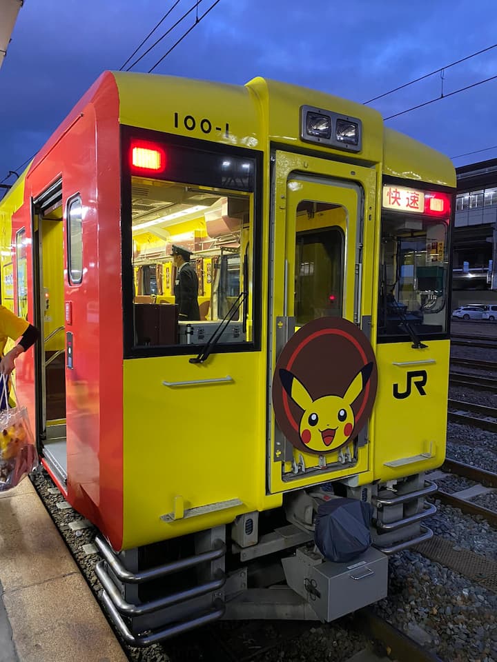 The Pokémon with You Train, showcasing vibrant Pokémon characters and themed carriages, inviting passengers into a world of adventure