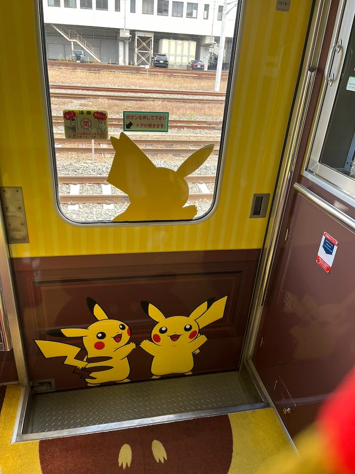 The Pokémon with You Train, showcasing vibrant Pokémon characters and themed carriages, inviting passengers into a world of adventure