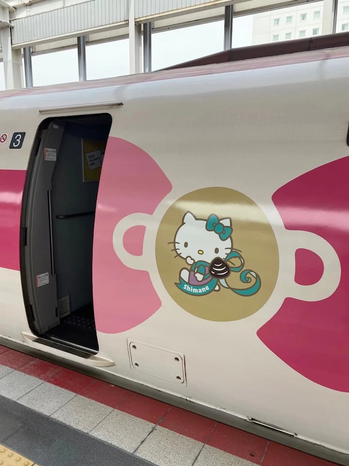 The Hello Kitty Shinkansen Bullet Train, with its signature pink exterior and adorable Hello Kitty-themed interior décor, creating a magical experience for passengers