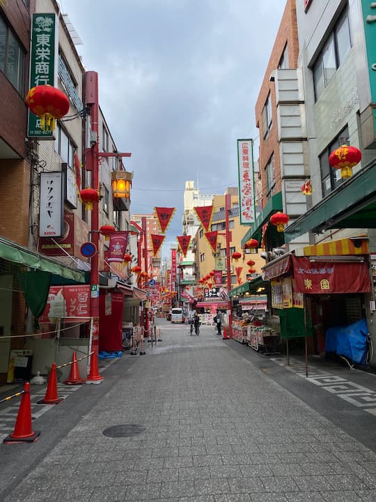 Vibrant shops and food stalls in Kobe Chinatown (Nankin-machi), offering a taste of Chinese culture