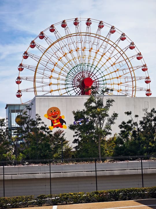 Kobe Port Tower in Meriken Park with scenic harbor views and visitors enjoying the refreshing sea breeze