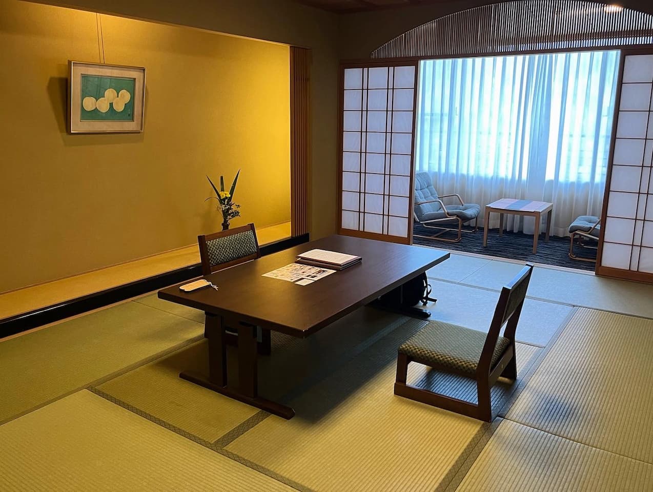 Spacious and serene room at Ginsuisou Choraku, featuring traditional Japanese tatami mats and furnishings