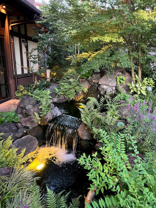 The tranquil setting of Higashiyama Garden in Kyoto, a French-Japanese fusion restaurant nestled within a traditional Japanese garden.