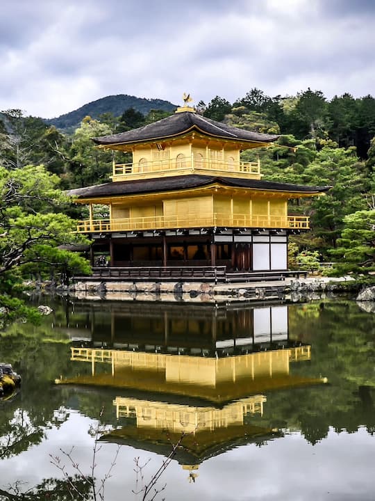 The iconic Golden Pavilion (Kinkaku-ji) with its reflection shimmering on the pond