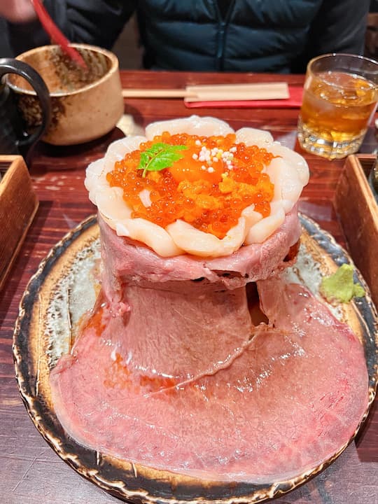 Wagyu Volcano dish with salmon roe and scallops at Wagyu Volcano OAGARI