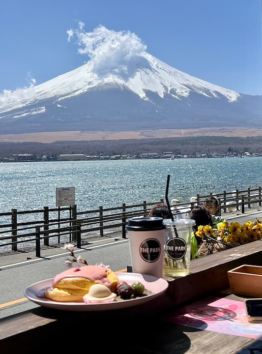 Enjoying delicious food at The Park Café with stunning views of Lake Yamanaka and Mount Fuji