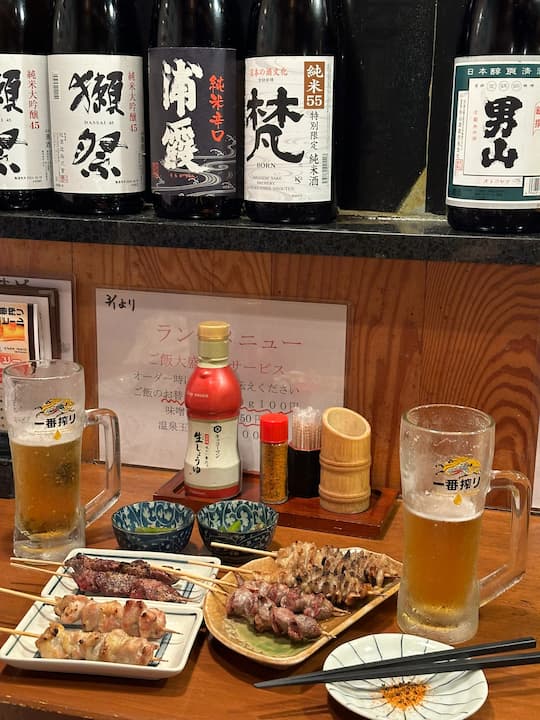 Grilled chicken skewers at YAKITORI Nonotori Nihonbashi restaurant in Tokyo