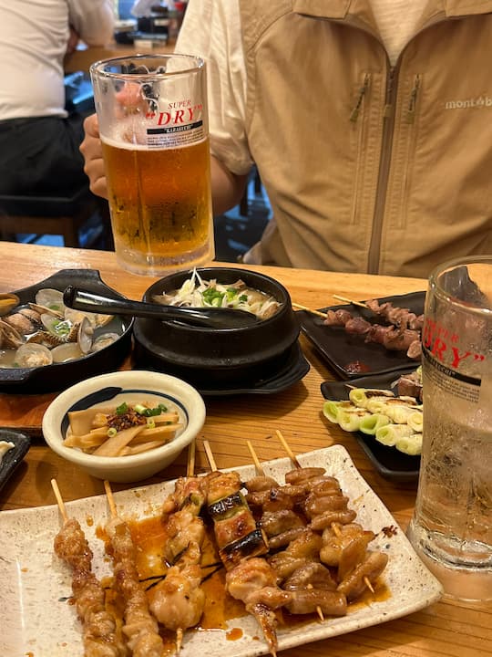 Varied dishes and drinks at Maruichi Sakaba (丸一酒场) restaurant in Tokyo