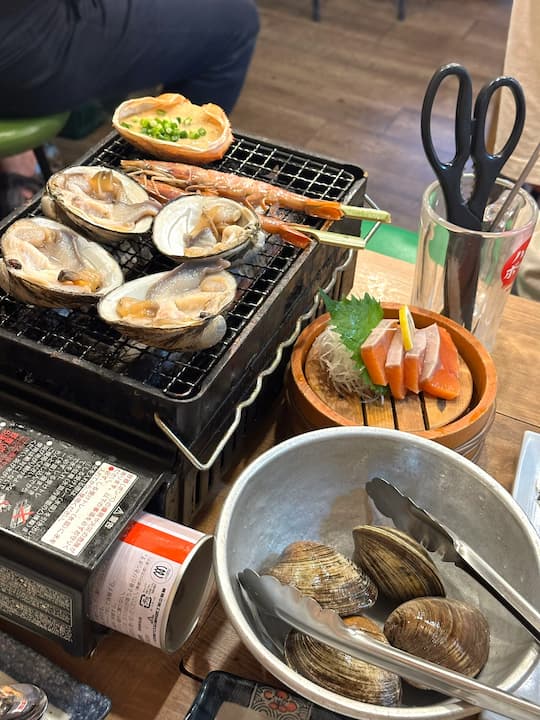 Grilled crab and Arctic surf clams at Isomaru Suisan restaurant in Osaka